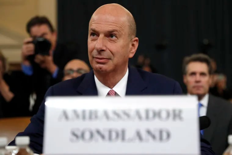 U.S. Ambassador to the European Union Gordon Sondland arrives to testify before the House Intelligence Committee on Capitol Hill in Washington, Wednesday, Nov. 20, 2019, during a public impeachment hearing of President Donald Trump's efforts to tie U.S. aid for Ukraine to investigations of his political opponents.