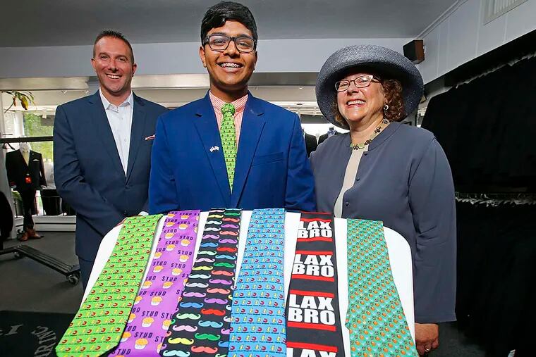 Shreyas Parab, 15, flanked by Steve Cassel, of Iacobucci Formal Wear, and Ellen Fisher, of YEA!