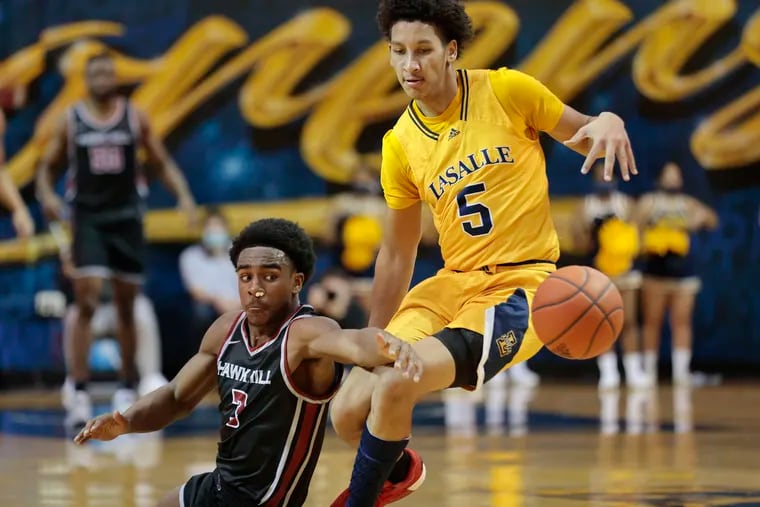 La Salle's Jack Clark (right) in action earlier this season. He scored 30 points against Duquesne on Saturday.