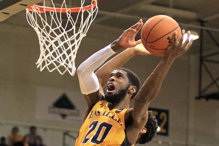B.J. Johnson of La Salle scores in the 2nd half of their game against Rhode Island on Feb. 20, 2018 at the Tom Gola Arena. Johnson finished with 31 points and 24 rebounds. CHARLES FOX / Staff Photographer