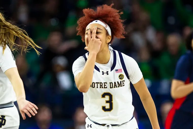 Notre Dame guard Hannah Hidalgo celebrates a teammate's three-pointer during the first half.
