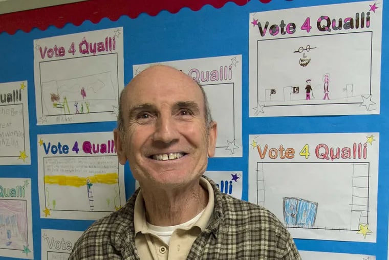 Ted Qualli, 66, beloved janitor at Newtown Elementary School in Newtown, Bucks County, stands March 23, 2017 in front of a bulletin board with “Vote 4 Qualli” coloring sheets colored by the first graders in support of Qualli’s bid to be named Janitor of the Year in a nationwide contest.