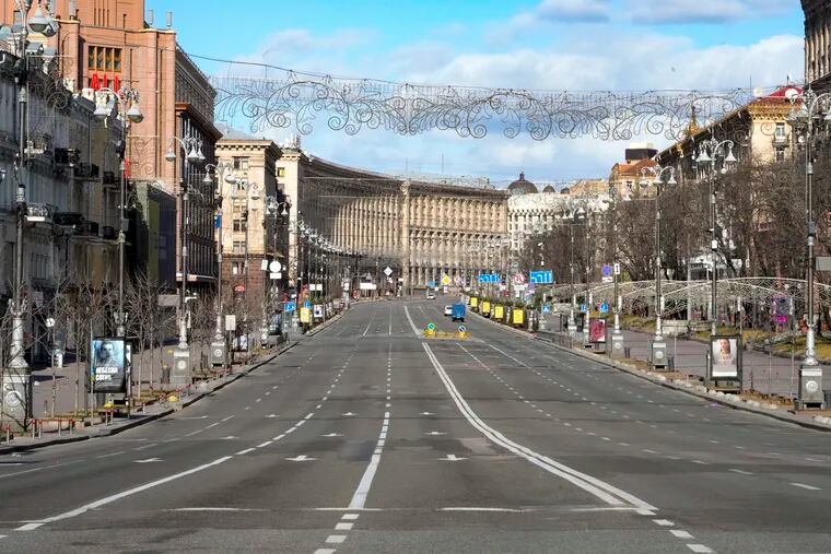 A view of Khreshchatyk, the main street, empty, due to curfew in the central of Kyiv, Ukraine, Sunday, Feb. 27, 2022. A Ukrainian official says street fighting has broken out in Ukraine's second-largest city of Kharkiv. Russian troops also put increasing pressure on strategic ports in the country's south following a wave of attacks on airfields and fuel facilities elsewhere that appeared to mark a new phase of Russia's invasion.