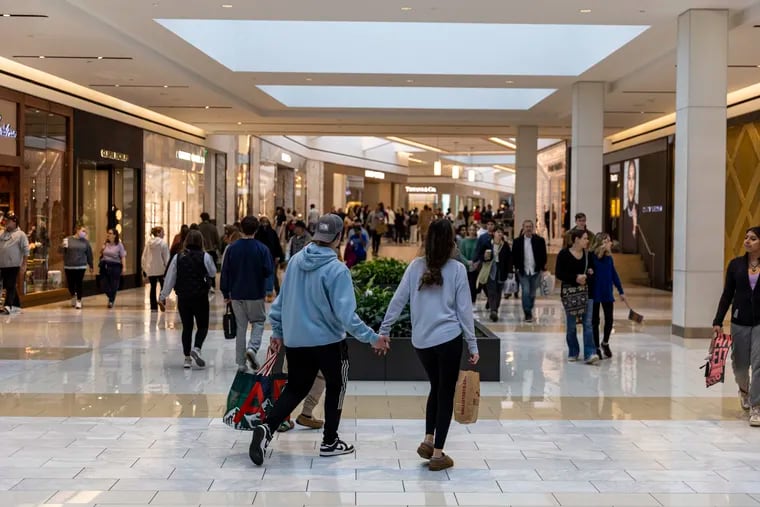 A couple shops at the King of Prussia Mall on Black Friday in 2022.