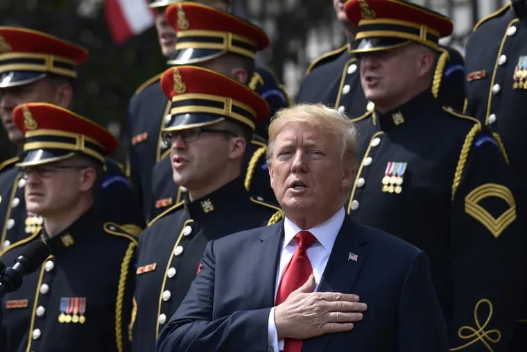 President Donald Trump sings the National Anthem during a "Celebration of America" event at the White House, Tuesday, June 5, 2018, in Washington, in lieu of a Super Bowl celebration for the NFL's Philadelphia Eagles that he canceled. 