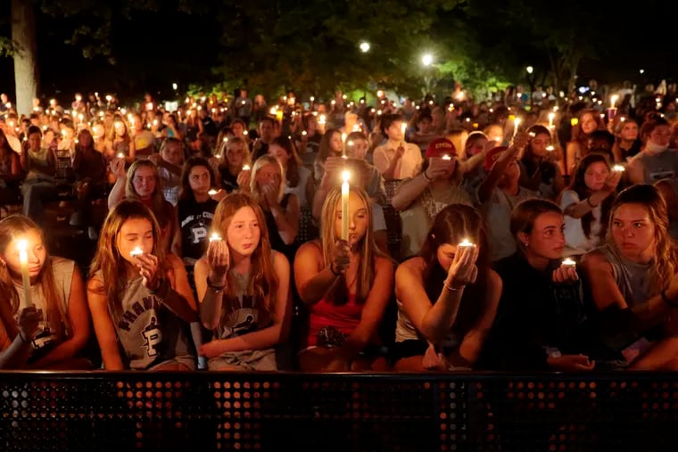 Friends and family of Norman Inferrera III during his candlelight memorial at Reeves Park in Phoenixville, Pa. on Aug. 22, 2021. The 16-year-old rookie Cape May lifeguard died Friday night of injuries sustained last week when his patrol boat flipped and knocked him unconscious.
