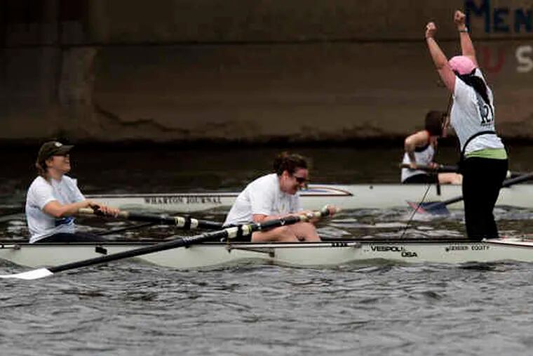 Coxswain Wendy Zalles cheers after sheand the restof her teamfrom Vanguard won in thenovice divisionof the Aberdeen Dad Vail Regatta's corporate challenge.