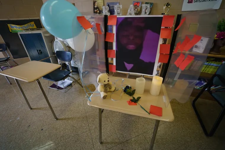 A memorial to Marcus, who was shot and killed earlier this month, was set up in his classroom at E.W. Rhodes Middle School on Oct. 14. Police obtained an arrest warrant for a 29-year-old man they say is responsible for his death.