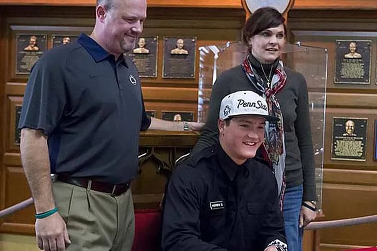 Christian Hackenberg, flanked by his parents, Erick and Nikki, poses at a ceremony celebrating the signing of his letter of intent to attend Penn State University. The highly-touted quarterback is from Fork Union Military Academy in Virginia. (Joe Hermitt/PennLive.com)