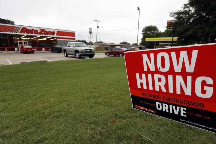 In this Sept. 27, 2018, file photo a bilingual help wanted sign for Auto Zone, a retailer of aftermarket automotive parts and accessories, is posted outside the store in Canton, Miss.