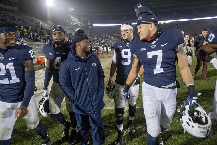 Penn State seniors, from left, Amani Oruwariye, Nick Scott, Mark Allen, Trace McSorley and Koa Farmer laugh as they take a lap around Beaver Stadium after the win over Maryland.