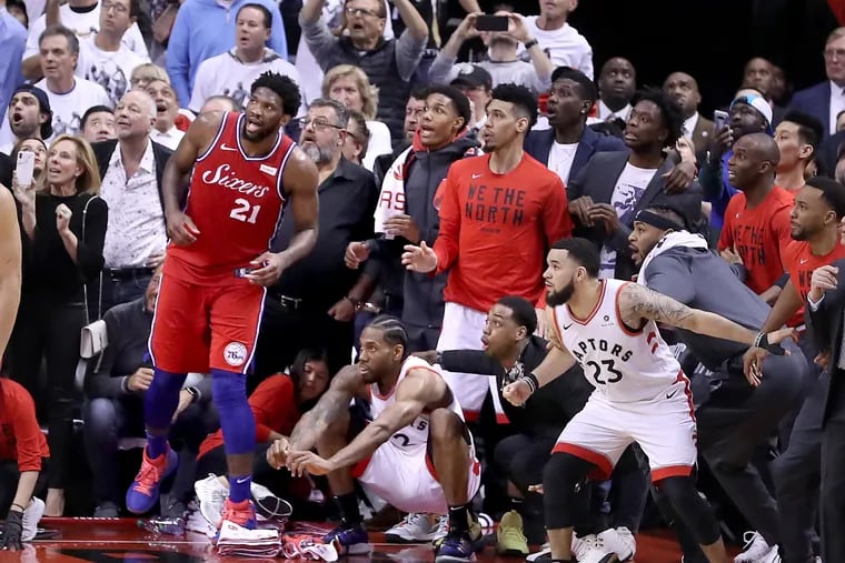 The Raptors' Kawhi Leonard watches his iconic, game-winning shot as it bounces on the rim four times before dropping to beat the Sixers in Game 7 of the 2019 Eastern Conference semifinals in Toronto.