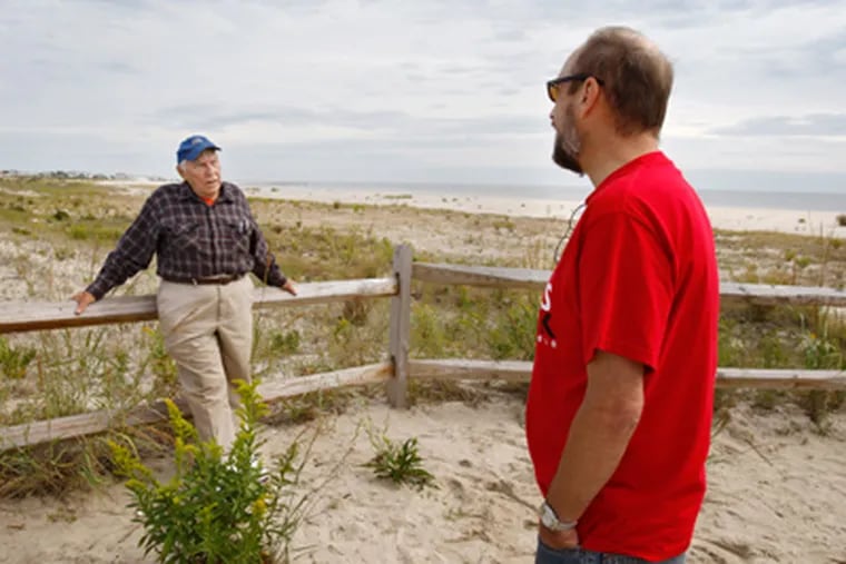 Where South Cape May thrived until a 1944 hurricane, Joseph G. Burcher, 86, visits Nature Conservancy land with son-in-law Robert Kenselaar. (Elizabeth Robertson / Staff Photographer)