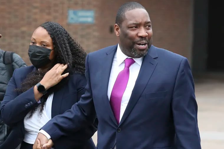 Philadelphia City Councilmember Kenyatta Johnson and his wife, Dawn Chavous, leave the federal courthouse in Philadelphia with supporters on Thursday after the first day of testimony in their federal bribery trial.