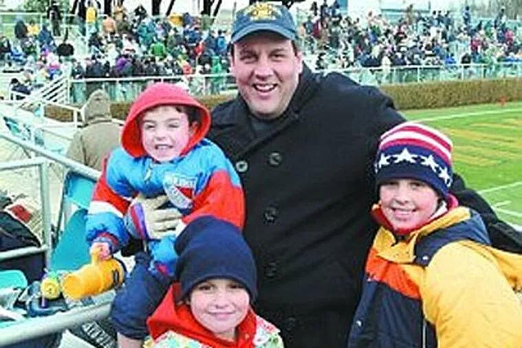 New Jersey Gov. Chris Christie at a 2003 University of Delaware football game with three of his four childern. (Photo by Eric Crossan)