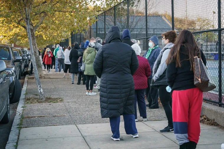 People wait in line to vote on November 3. We have the best, most productive ways to pass time while you wait to cast a ballot.