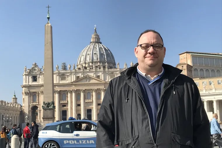 Jim VanSickle, a victim of clergy sex abuse from Pittsburgh, stands in St. Peter's Square during Pope Francis' global summit of Catholic leaders in Vatican City last week.