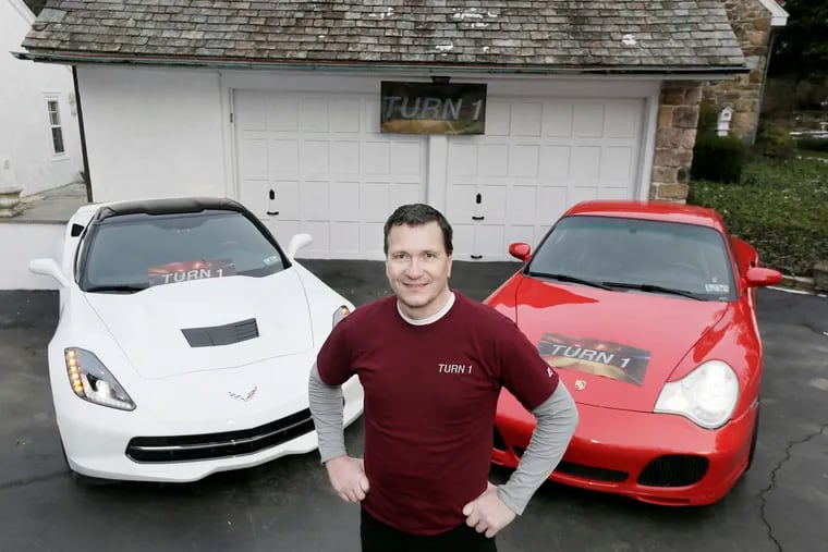Andy Vitek with his 2017 Corvette (left) and 2003 Porsche 911 at his Huntingdon Valley home on January 17, 2019.