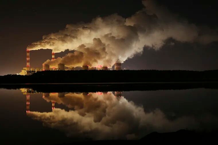 FILE - In this Wednesday, Nov. 28, 2018 file photo, plumes of smoke rise from Europe's largest lignite power plant in Belchatow, central Poland. After several years of little growth, global emissions of heat-trapping carbon dioxide surged in 2018 with the largest jump in seven years, discouraged scientists announced Wednesday, Dec. 5, 2018. (AP Photo/Czarek Sokolowski)