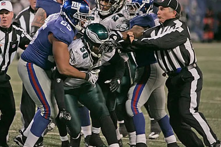 A league source said Trent Cole was fined $15,000 for punching Giants center Shaun O'Hara during a braw Sunday night. (Michael Bryant/Staff Photographer)