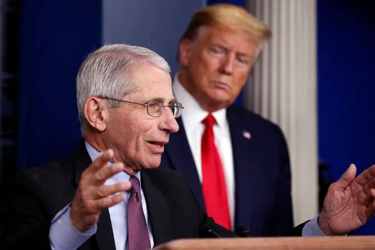 FILE - In this April 22, 2020 file photo, President Donald Trump watches as Dr. Anthony Fauci, director of the National Institute of Allergy and Infectious Diseases, speaks about the coronavirus in the James Brady Press Briefing Room of the White House in Washington.