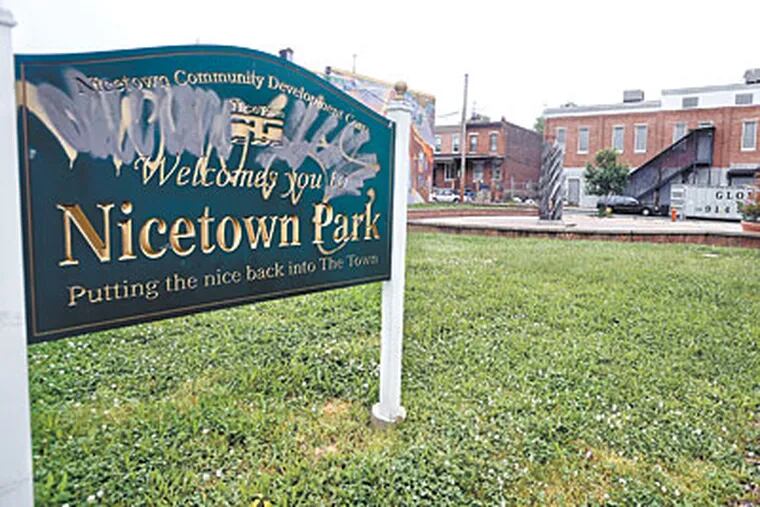 The sign at Nicetown Park reads, "Putting the nice back in Nicetown." The neighborhood once flourished, but declined after manufacturing pulled out, leaving crumbling factories. (SHARON GEKOSKI-KIMMEL / Staff Photographer)