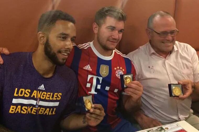 Displaying medals they were awarded Saturday by the mayor of Arras, France, are (from left) Anthony Sadler, Spec. Alek Skarlatos, and Chris Norman. The men helped thwart a terror attack Friday on a high-speed train. Arras City Hall via AP