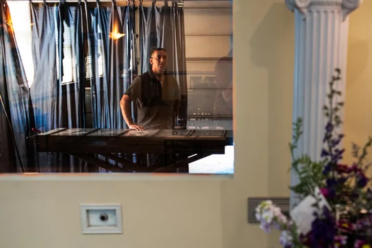 Families can observe the beginnings of the cremation process through a window in the chapel at Galzerano Funeral Home in Levittown. Robert Dzieniszewski, crematory operator, says that cremations take up to two and half hours. June 20, 2014. (MATTHEW HALL/Staff Photographer)
