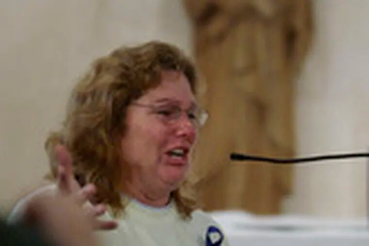 Tears come to Trish Blauth of Vineland, N.J., as she speaks to Bishop Joseph A. Galante during the meeting at St. Mary&#0039;s.