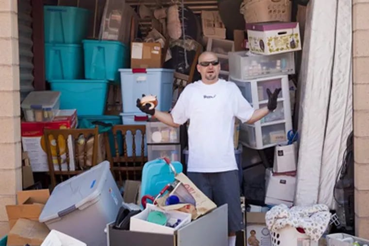 Jarrod Schultz appears in "Storage Wars," one of the shows that illustrate the excesses of our society &mdash; so much consumerism that some people can't manage all of their stuff. STUART PETTICAN