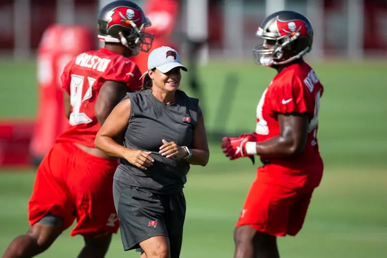 Buccaneers assistant defensive-line coach Lori Locust on the field during minicamp.