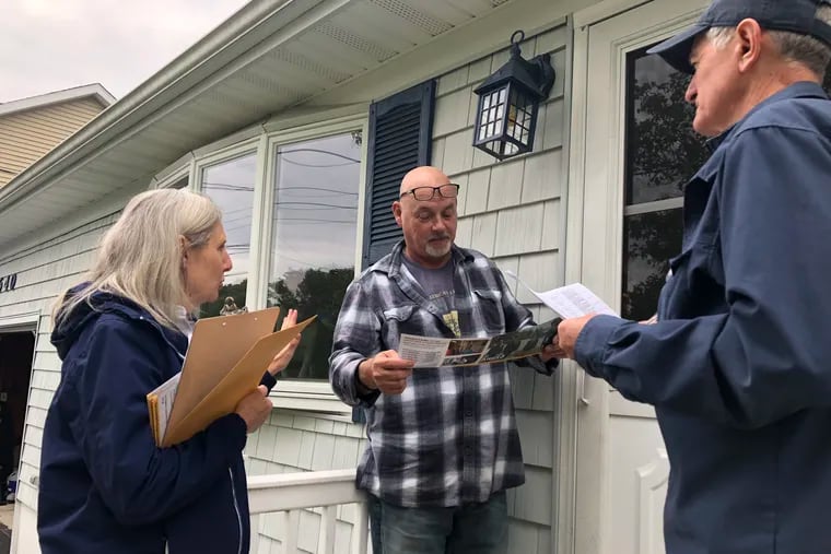 Judd Wampole and Laura Docherty of Brick Township went canvassing for the first time in their neighborhood on behalf of Andy Kim, congressional candidate running against Rep. Tom MacArthur. Here they found a sympathetic Kim supporter, Jimmy Davis.
