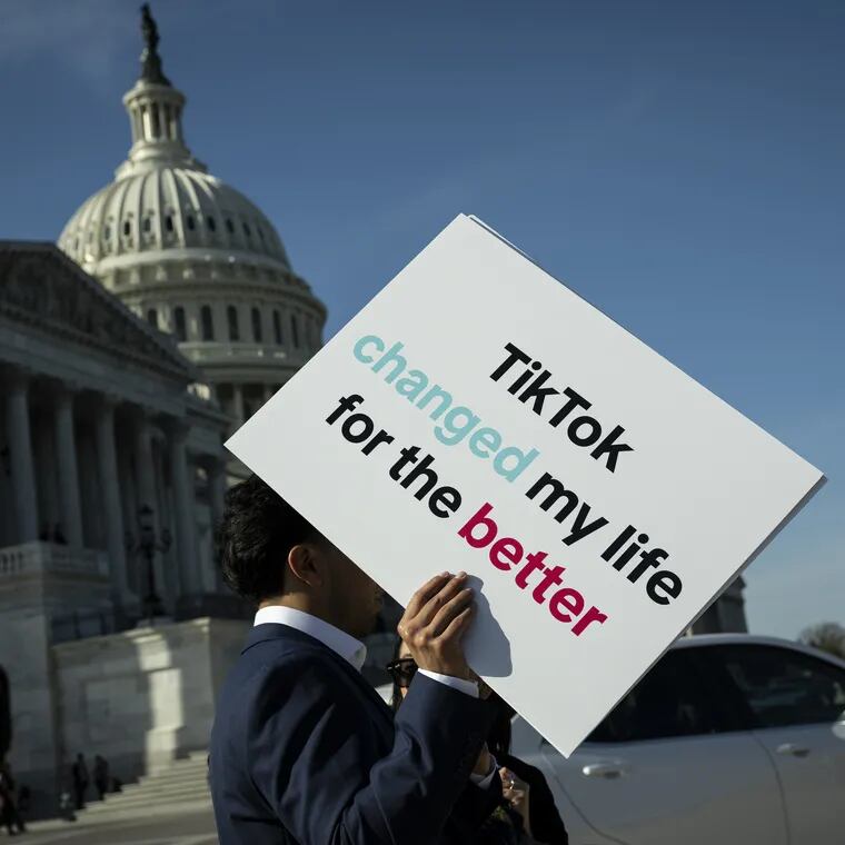 An advocate holds a sign for TikTok following a news conference outside the U.S. Capitol on Tuesday, March 12, 2024.