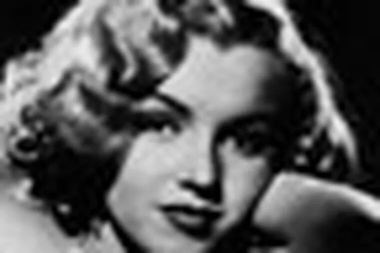 FILE - This undated photo shows actress Marilyn Monroe. In late 2012, the FBI has released a new version of files it kept on Monroe that reveal the names of some of her acquaintances who had drawn concern from government officials and members of her entourage over their suspected ties to communism. (AP Photo, File)