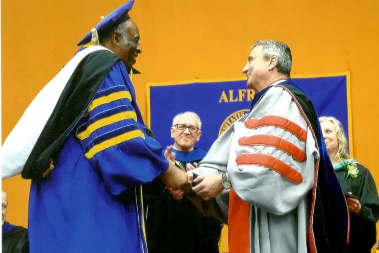 Warren Sutton receives an honorary diploma from Alfred University in 2017.