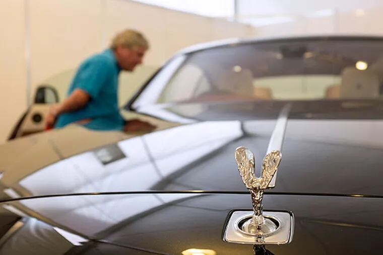 The "The Spirit of Ecstasy" or "Flying Lady" mascot sits on the hood of a Wraith automobile, manufactured by Rolls-Royce Motor Cars Ltd., on display at the company's stand at the Singapore Yacht Show in Singapore, on Thursday, April 10, 2014. The show runs through April 13. (Charles Pertwee/Bloomberg)