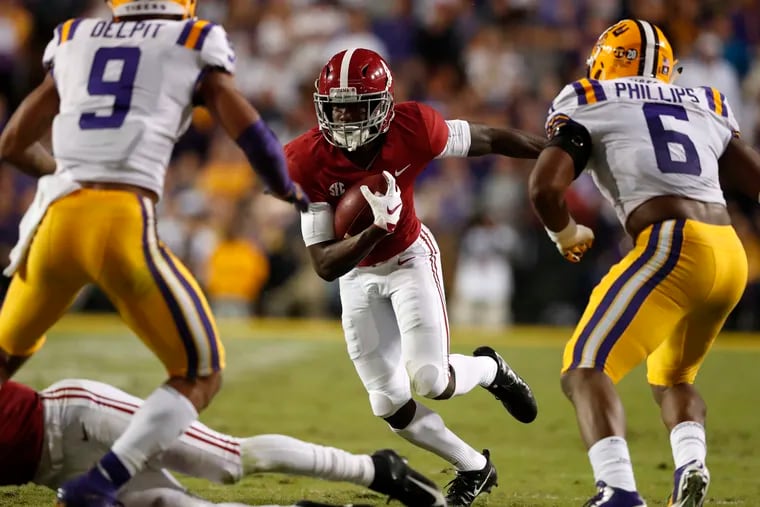 Alabama wide receiver Jerry Jeudy meets up with LSU defenders Grant Delpit and Jacob Phillips in last season's game in Baton Rouge, a 29-0 win for the Crimson Tide.