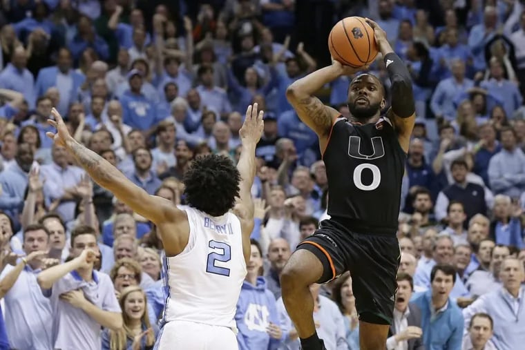 Miami’s Ja’Quan Newton rises up with the game-winning shot as time expires in the Hurricanes 91-88 upset at North Carolina.