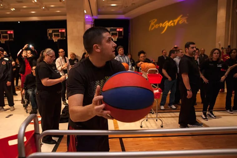 It came down to the last basket for Al Callejas of Archbald, Pa., to
take first place and a $10,000 prize, winning the Borgata's free-throw challenge March 21, 2015, in Atlantic City. Callejas, a 2001 graduate of the University of Scranton, played point guard. (CHRIS FASCENELLI/Staff Photographer)