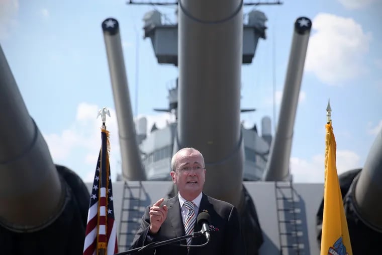 Gov. Phil Murphy speaking during a naturalization ceremony on the battleship USS New Jersey in Camden on July 4.