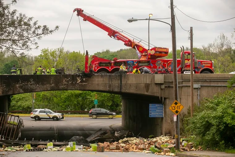 Highway crews clear a fatal tractor trailer accident from Interstate 76 eastbound above Sweet Briar Drive, the access road to Martin Luther King Drive.
