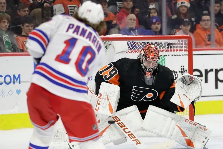 Flyers goaltender Carter Hart stops New York Rangers left winger Artemi Panarin during the second-period Monday at the Wells Fargo Center.
