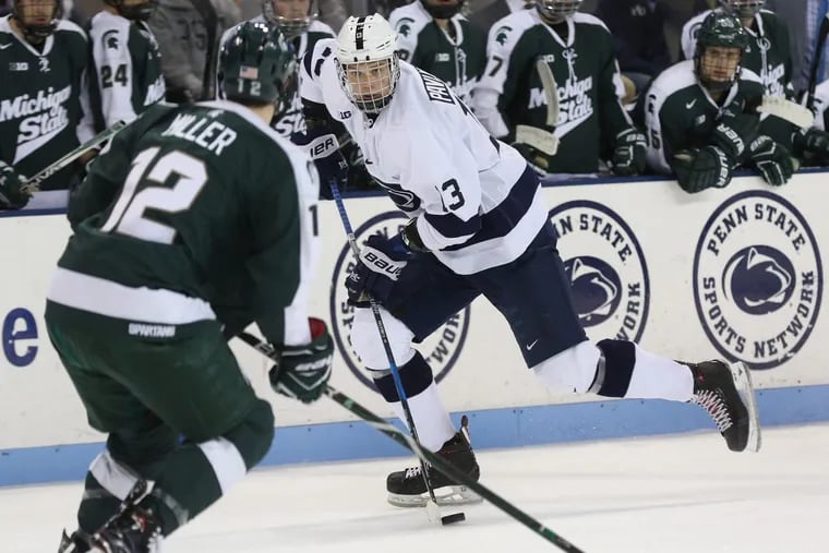 Penn State’s Nikita Pavlychev (13) carrying the puck against Michigan State on Nov. 24, 2017.