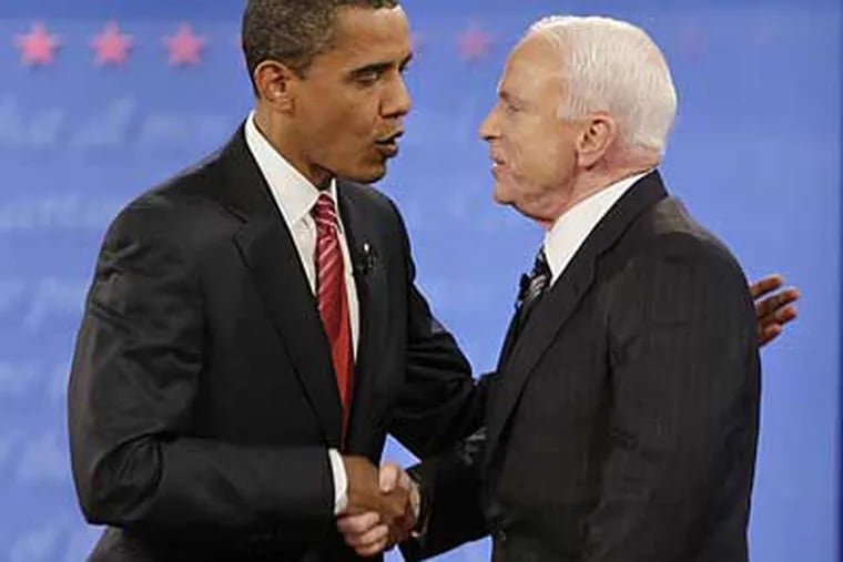 Sens. Barack Obama and John McCain shake hands. (J. Scott Applewhite / AP)