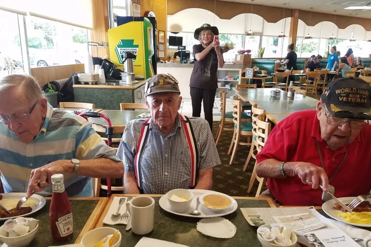 To battle isolation, 97-year-old Alex Kane (right) breakfasts every Friday at Corner Cafe in Rockledge with other seniors, inviting old friends and many new that he meets in the restaurant, such as Maurice Berry (center), Narissa Ferrer (rear) and Walter Waldron (left).