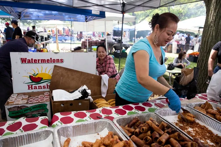 Ha Luu works a stall at the Southeast Asian Market at FDR Park in Philadelphia, Pa. on Sunday, May 7, 2023. The market is open on Saturdays and Sundays from April to October.