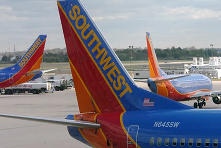 Southwest Airlines planes on the apron at Terminal E at the Philadelphia International Airport. (Clem Murray / Staff photographer)