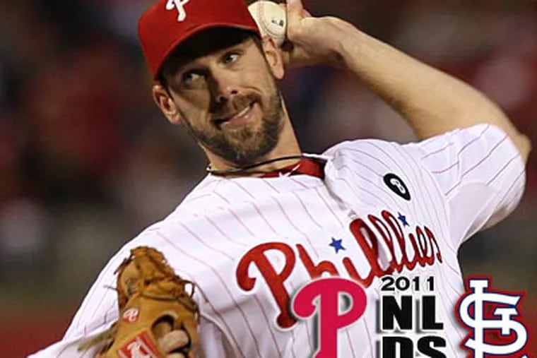 Cliff Lee throws a pitch against the Cardinals during Game 2 on Sunday night. (Clem Murray/Staff Photographer)