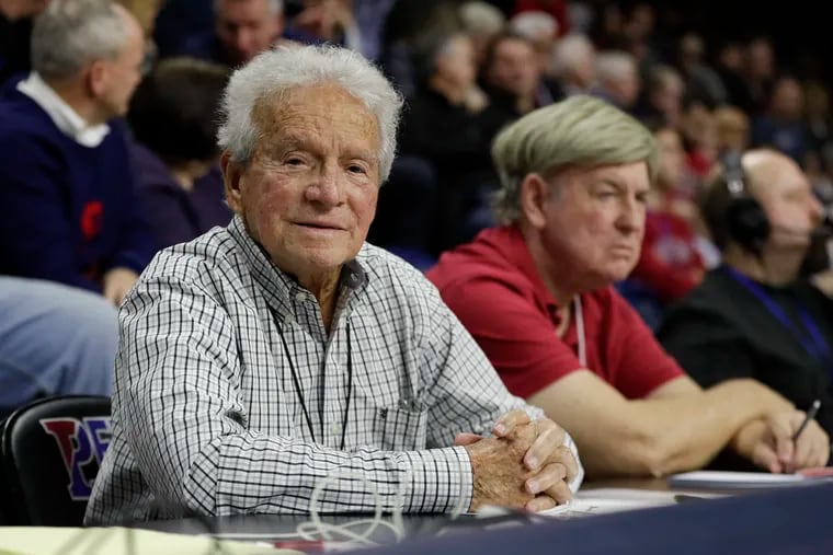 Long time Associated Press correspondent Jack Scheuer sits courtside watching Penn take on Princeton at The Palestra on Saturday.