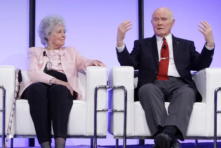 Sen. John Glenn, right, with his wife Annie, answering questions during a celebration dinner in 2012 honoring his legacy on the 50th anniversary of his historic flight aboard Friendship 7.